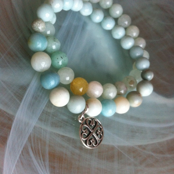 Set of two Stretch bracelets composed of smooth Amazonite beads and faceted blue Amazonites and Burmese Jade in shades of blue and white