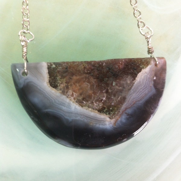 Man / Woman Pendant of an Agate stone from Botswana, an open stone which reveals the crystallized interior of the stone