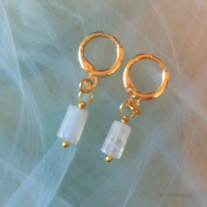 Delicate Moonstone earrings, the stone of femininity, symbol of abundance and fertility, suspended from gold-plated hoop earrings