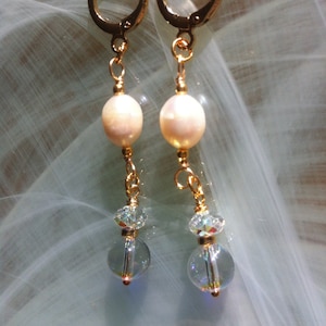 White freshwater pearl earrings with a vintage Swarovski Aurora Borealis crystal pendant and gold plated hoops