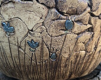 Planting bowl with blue flowers