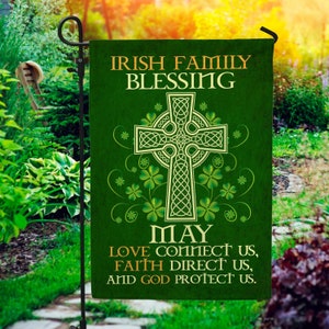 May include: A green garden flag with a Celtic cross design and shamrocks. The text reads "Irish Family Blessing May Love Connect Us, Faith Direct Us, And God Protect Us."
