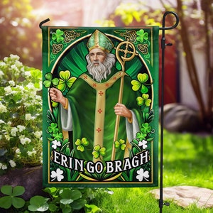 May include: A green garden flag with a cartoon illustration of a man with a white beard and a green robe holding a staff. The flag has the text "Erin Go Bragh" in a white banner.