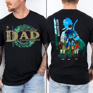 May include: Black t-shirt with a green and gold graphic that says "The Legend of Dad Children of the Wild". The back of the shirt has a silhouette of a man and three children with the text "Best Dad Ever".
