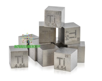 May include: A group of silver-colored titanium cubes, each with the chemical symbol "Ti" and atomic number "22" engraved on them. The cubes are stacked in a pyramid shape.