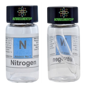 May include: Two clear glass bottles with black lids and labels. The labels have a white background with blue text and a large letter "N" in the centre. The text on the labels reads "Atomic No 7 Nitrogen" and "NOVAELEMENTS®".