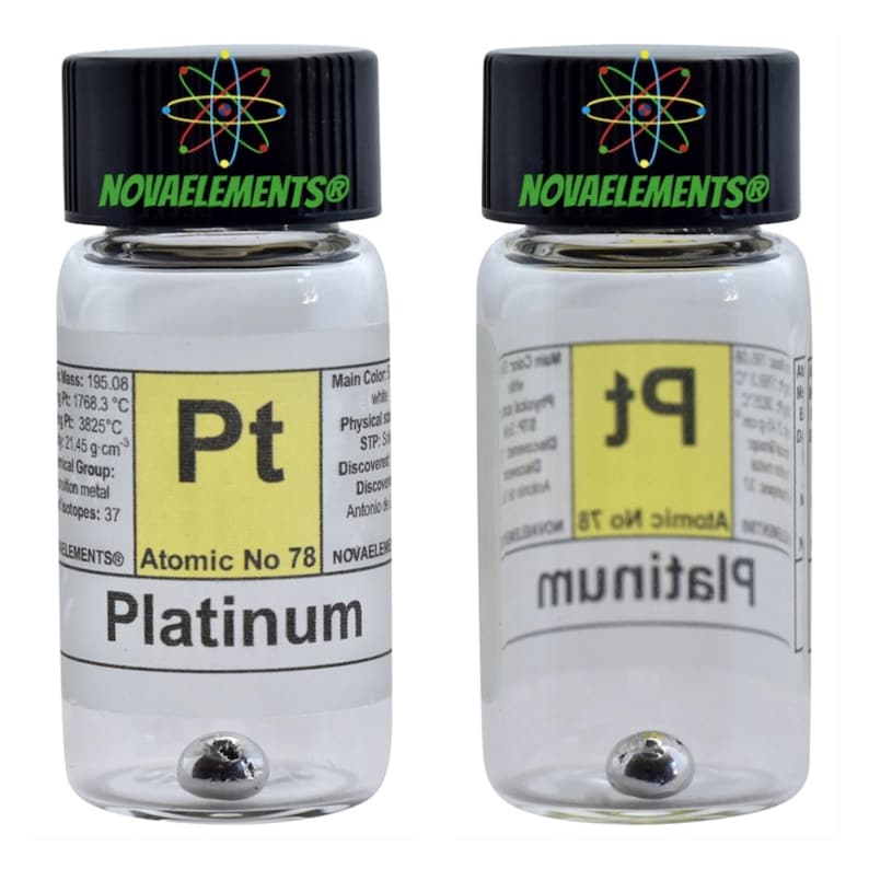 May include: Two clear glass bottles with black lids containing a small silver ball. The bottles have labels with the chemical symbol and name for platinum, "Pt" and "Platinum", along with the atomic number "78". The labels also have the text "Novaelements&reg;".