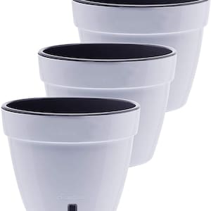May include: Set of three white ceramic flower pots with a black rim. The pots are different sizes and have a 'Santino' logo on the smallest pot.