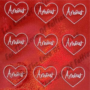 May include: Nine red heart-shaped stickers with the word "Amour" in white script. Each heart is outlined with a white stitched border. The background is a shiny, glittery red.