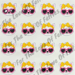 May include: A repeating pattern of white cat faces with yellow hair bows and pink heart-shaped sunglasses. The sunglasses have black glitter lenses. The phrase "The Love Of Felines" is printed in a repeating pattern in the background.