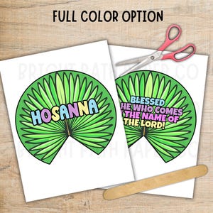 May include: Two white paper cutouts with green palm leaf designs and colorful text. One says "HOSANNA" and the other says "BLESSED HE WHO COMES THE NAME OF THE LORD!". A pair of pink-handled scissors and a wooden craft stick are also present.