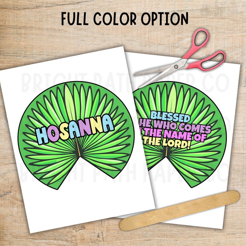 May include: Two white paper cutouts with green palm leaf designs and colorful text. One says "HOSANNA" and the other says "BLESSED HE WHO COMES THE NAME OF THE LORD!". A pair of pink-handled scissors and a wooden craft stick are also present.
