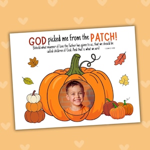 May include: A white rectangular print featuring a large orange pumpkin with a circular cutout for a photo. The text reads: GOD picked me from the PATCH! Behold what manner of love the Father has given to us, that we should be called children of God. And that is what we are! 1 JOHN 3:1 ESV. Smaller pumpkins and autumn leaves surround the central pumpkin.