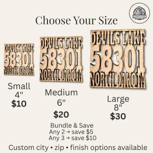 May include: Wooden signs with the text "Devils Lake 58301 North Dakota" in three sizes: small (4 inches), medium (6 inches), and large (8 inches). The signs are made of light-colored wood and feature a rustic design.