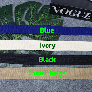 May include: Four different colors of cotton webbing, from left to right: blue, ivory, black, and camel beige.