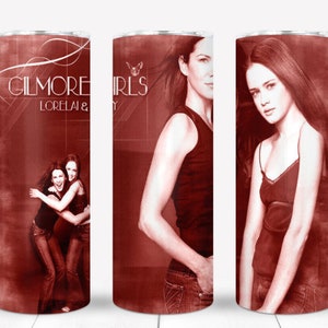 May include: A red and white tumbler with a design featuring the text "Gilmore Girls Lorelai & Rory" and a photo of two women.