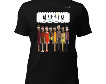 May include: A black short-sleeved t-shirt featuring a graphic print of eight cartoon characters standing in a row. Above the characters is a white rectangular box containing the text "MARTIN" in a stylized black font with small colorful accents.