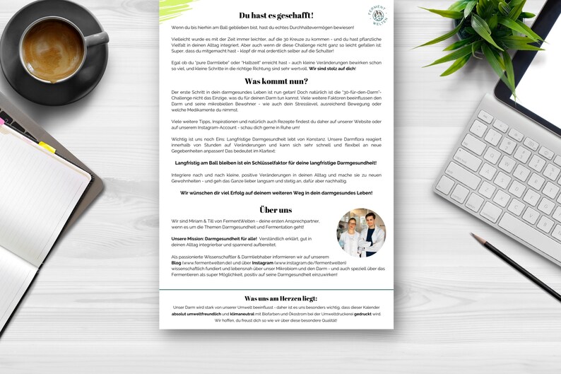 May include: A white and green flyer with the title "Du hast es geschafft!"  The flyer is about gut health and features a photo of two people in white lab coats. The text on the flyer discusses the importance of gut health and provides tips for maintaining a healthy gut.