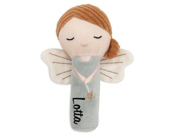 May include: A plush angel rattle with wings, a light blue dress, and a star. The rattle is personalised with the name "Lotta".