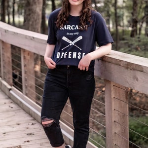 Teen Wolf tv show tshirt with the stiles stilinski, dylan obrien, quote, sarcasm is my only defense, with art of baseball bats, perfect merchandise or christmas gift for any teen wolf fan, gift for her