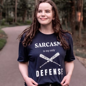 Teen Wolf tv show tshirt with the stiles stilinski, dylan obrien, quote, sarcasm is my only defense, with art of baseball bats, perfect merchandise or christmas gift for any teen wolf fan, gift for her