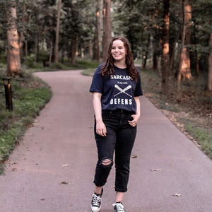 Teen Wolf tv show tshirt with the stiles stilinski, dylan obrien, quote, sarcasm is my only defense, with art of baseball bats, perfect merchandise or christmas gift for any teen wolf fan, gift for her