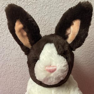 May include: A set of three ceramic mugs with a speckled, matte finish. The mugs are in shades of cream, light gray, and dark gray. Each mug has a simple, minimalist design, perfect for coffee or tea.