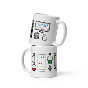 May include: Two white ceramic mugs stacked on top of each other. The top mug has a black and white illustration of a computer monitor with a graph, a newspaper, and a coffee cup. The bottom mug has a black and white illustration of a beaker, a flask, a pipette, and a test tube. The beaker has blue, red, and yellow dots on it. The flask has green liquid inside. The pipette has a red bulb on the end. The test tube has a blue and white label on it.