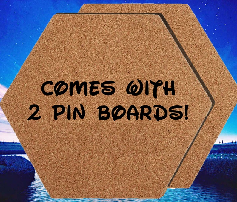 May include: Two brown cork hexagon-shaped pin boards with the text "COMES WITH 2 PIN BOARDS!" printed in black.