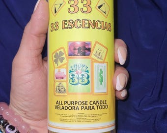 Puede incluir: Vela amarilla y blanca con el texto "Veladora de Cocktail 33 Esencias All Purpose Candle Veladora Para Todo" e imágenes de un trébol de cuatro hojas, una alcancía, un billete de dólar, un hombre musculoso y un corazón.