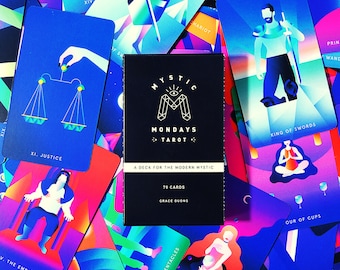 May include: A deck of 78 tarot cards with a black box featuring the text "Mystic Mondays Tarot" and "A Deck for the Modern Mystic". The cards feature colorful illustrations with geometric shapes and bold colors.