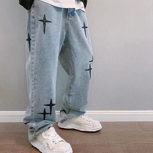 Baggy retro style jeans with embroiderd crosses