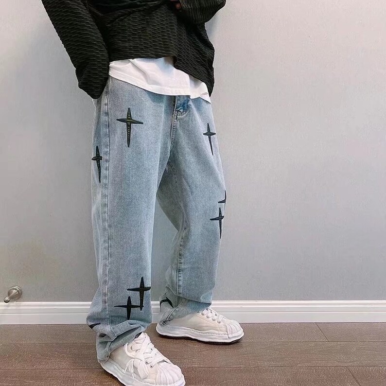 Baggy retro style jeans with embroiderd crosses 