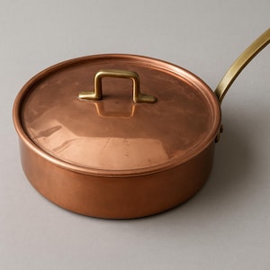 Vintage koperen pan met messing handvat