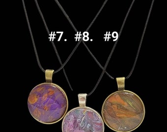 Unisex Acrylic Fluid Art Silver Round pendant necklaces in 9 different styles and colors. Men's, women's, kids funky  designs in 9 styles.