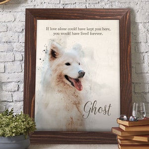 May include: A framed watercolor print featuring a white Samoyed dog with a pink tongue. The print has the text "If love alone could have kept you here, you would have lived forever." and the name "Ghost". The frame is dark brown.