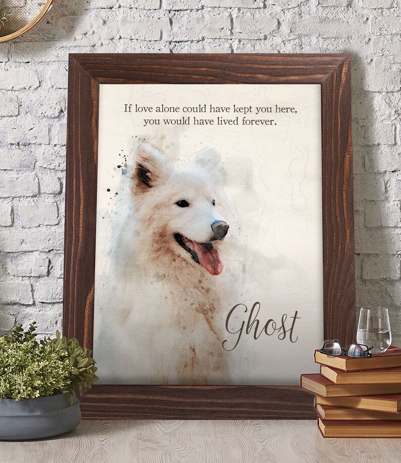 May include: A framed watercolor print featuring a white Samoyed dog with a pink tongue. The print has the text "If love alone could have kept you here, you would have lived forever." and the name "Ghost". The frame is dark brown.