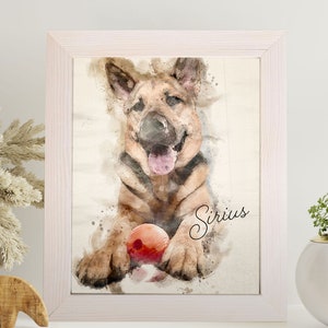 May include: Watercolor-style framed print of a German Shepherd puppy with a red ball. The dog is brown and black with its tongue out. The name "Sirius" is written in cursive. The frame is white.