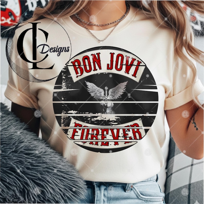 May include: A cream-colored short-sleeve t-shirt featuring a circular graphic on the chest. The graphic contains the text BON JOVI in red letters at the top and FOREVER in red letters at the bottom, with a central illustration of a winged heart.