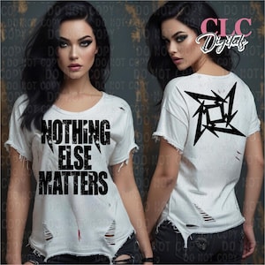 May include: A white t-shirt with distressed detailing. The front of the shirt has the text "NOTHING ELSE MATTERS" in black with a grunge effect. The back of the shirt has a black stylized ninja star design.