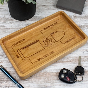 May include: A wooden tray with a laser-engraved design of a bullet with the words "Bang Button", "Metal Holdy Thing", "Magical Fire Dust", and "Freedom Seed".