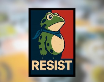 May include: A rectangular graphic print featuring a green frog with dark spots wearing a blue neckerchief. The background is split vertically between dark blue and red. The word RESIST is printed in large, bold, light-colored capital letters below.