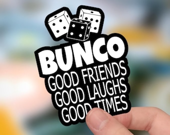 May include: A black and white sticker featuring three dice at the top and the text BUNCO GOOD FRIENDS GOOD LAUGHS GOOD TIMES in bold white capital letters. The design has a thick black border and a white background for the text and dice graphics.