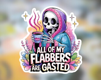 May include: A sticker featuring a cartoon skeleton in a blue robe and purple hood, holding a coffee cup. The text "ALL OF MY FLABBERS ARE GASTED" is displayed in a bold, colorful font. The design includes floral and star accents.