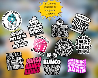May include: A 12-pack of 2-inch die-cut stickers or magnets featuring various Bunco-themed designs. The collection includes black and white text-based graphics, a pink die, and a blue cartoon die, all with phrases related to the game of Bunco.