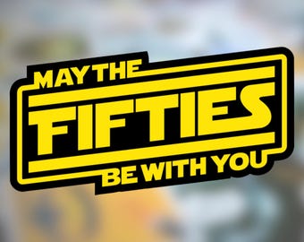 May include: A yellow and black rectangular sticker with the text "MAY THE FIFTIES BE WITH YOU". The text is in a bold, sans-serif font, with the word "FIFTIES" in a larger font size. The sticker has a black border.