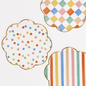 May include: Three paper plates with scalloped edges and gold trim. The plates feature different colorful patterns: polka dots, stripes, and a checkered design.