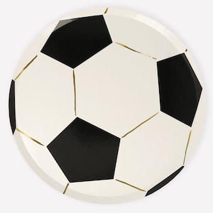 May include: White paper party plate with a black and white soccer ball design. The soccer ball has gold lines.