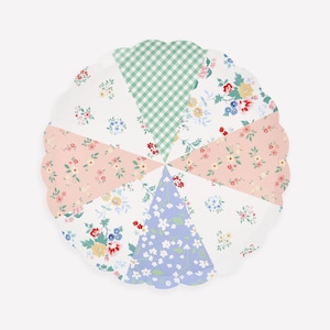 May include: A round scalloped paper plate featuring a segmented design of six triangular sections. The patterns include a green and white gingham check, a light blue floral print, and various white backgrounds with small pink, yellow, and blue flowers.