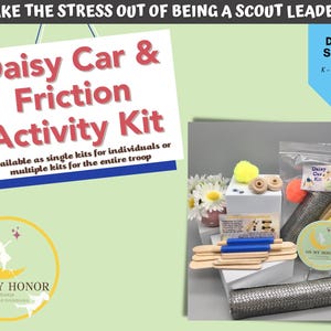 May include: A kit for Daisy Scouts, featuring a sign that reads "Daisy Car & Friction Activity Kit." The image includes craft supplies, a badge, and the text "Take the stress out of being a scout leader!"